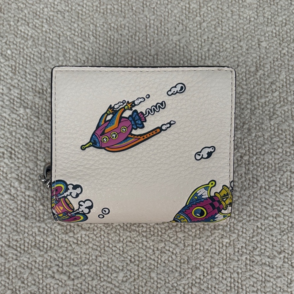MOVING SALE 🚀 Coach Cosmic Wallet with Colorful Rocket Design
LAST DISCOUNT - Picture 2 of 7